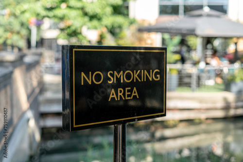 No smoking area sign outside in the street