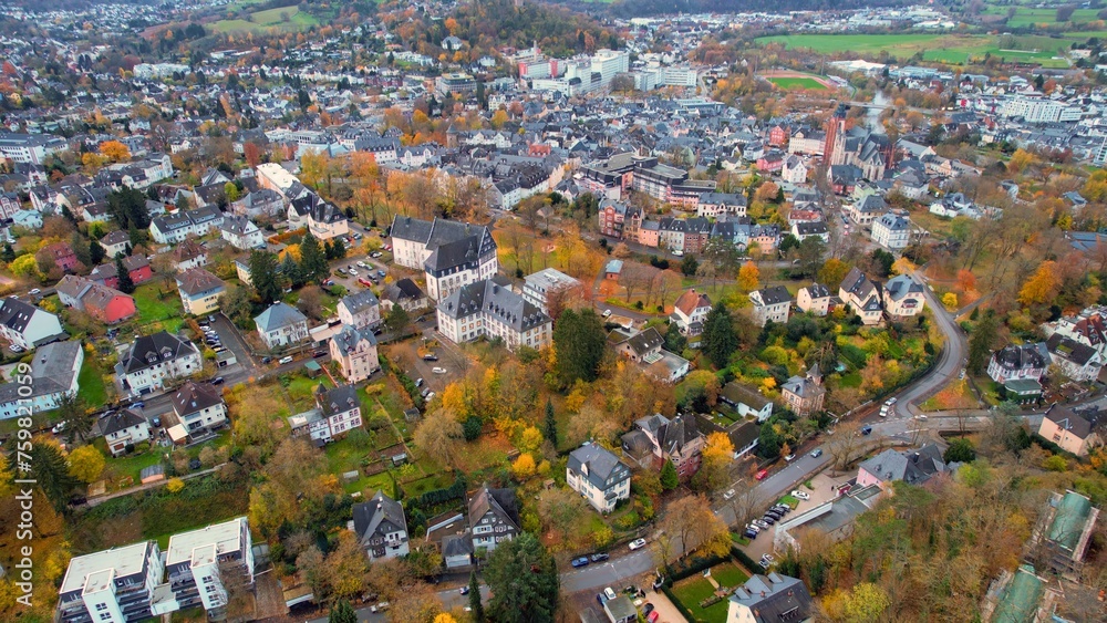Aerial view of the old town around the city Wetzlar on an overcast day in fall in Germany.	