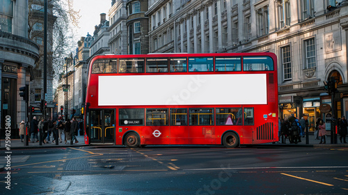Red london bus with blank white place for mockup information is parked at urban street with stone road and sidewalk
