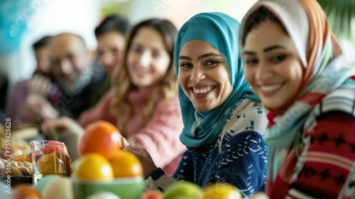 Group of friends share a moment of joy during a meal in Ramadan with smiles and laughter