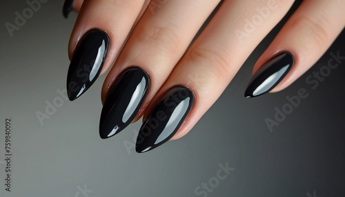 Elegant black stiletto nails glossy finish photo