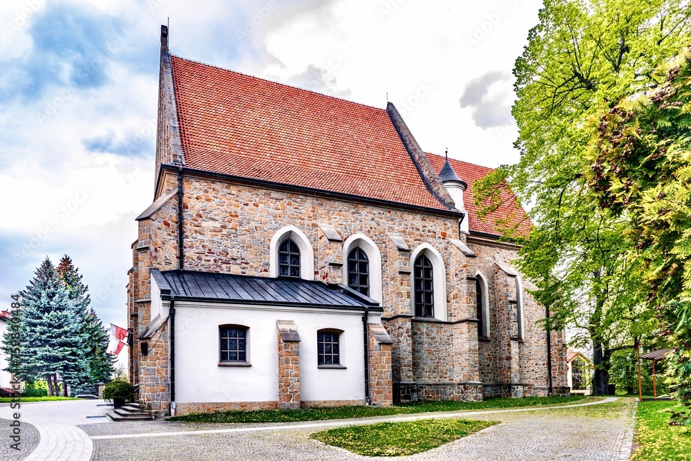 Catholic Cathedral in Jaslo, Poland. A Catholic church is a religious building that serves as a gathering place for believers to read prayers.