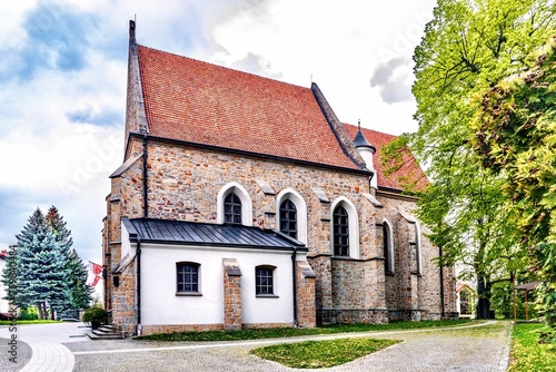Obraz na płótnie Catholic Cathedral in Jaslo, Poland. A Catholic church is a religious building that serves as a gathering place for believers to read prayers. w salonie