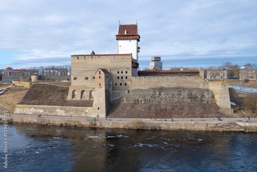 View of the ancient Hermann Castle on a sunny March day. Narva, Estonia