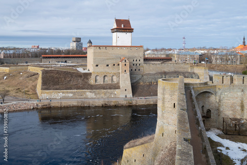 View of the ancient Herman castle from the wall of the Ivangorod fortress on a March day. Border between Estonia and Russia photo