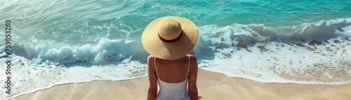 Woman in summer hat on beach ocean ahead