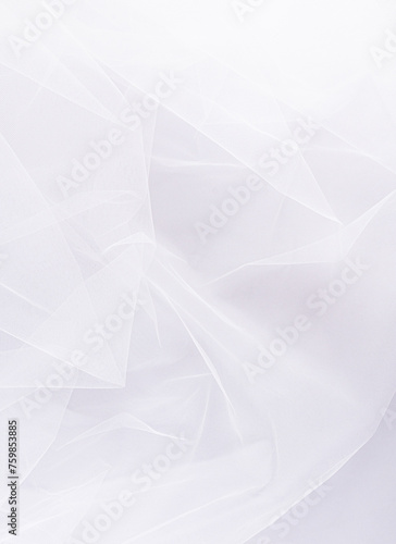 Elegant vertical background of the bridal classic veil in snow-white color. Beautiful folds of fabric. A copy space. layout. design. Wedding concept. photo