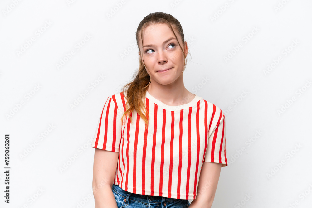 Young caucasian girl isolated on white background having doubts while looking up Young caucasian girl isolated on white background having doubts while looking up