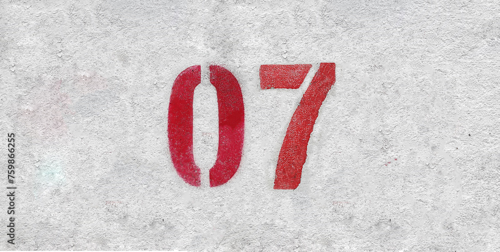 Red Number 07 on the white wall. Spray paint. Red Number 07 on the white wall. Spray paint.