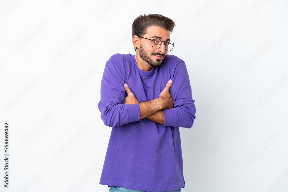 Young caucasian man isolated on white background making doubts gesture while lifting the shoulders Young caucasian man isolated on white background making doubts gesture while lifting the shoulders