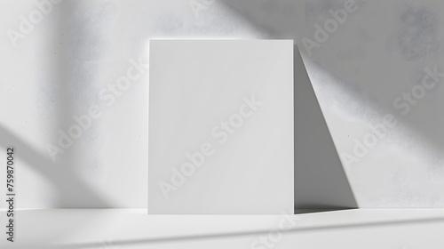 Blank White Paper Poster Leaning on White Studio Room Wall as Copy Space