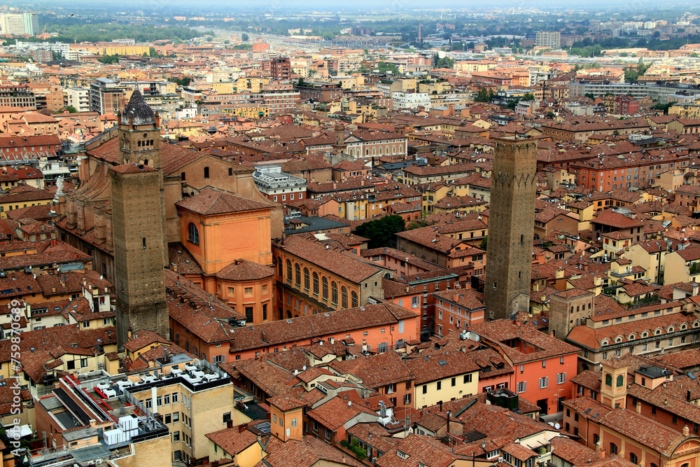 High angle view of the historic part of the city of Bologna (Italy) with the Cathedral of San Pietro and two medieval towers in the center of the photo