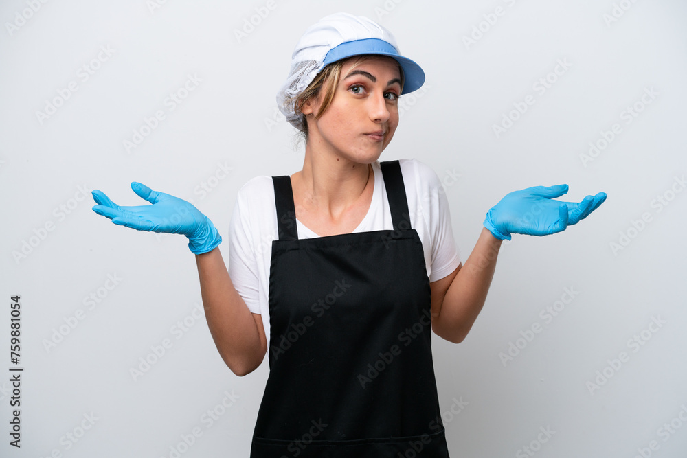 Fishwife woman isolated on white background having doubts while raising hands Fishwife woman isolated on white background having doubts while raising hands