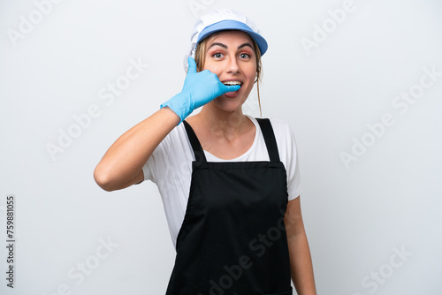 Fishwife woman isolated on white background making phone gesture. Call me back sign