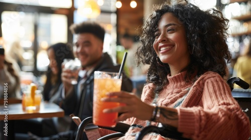 Smiling woman in a wheelchair enjoying a casual mocktail hour with friends  highlighting inclusive social experiences in diverse settings