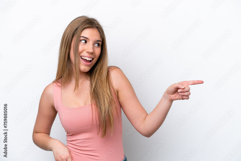 Young caucasian woman isolated on white bakcground pointing finger to the side and presenting a product Young caucasian woman isolated on white bakcground pointing finger to the side and presenting a product