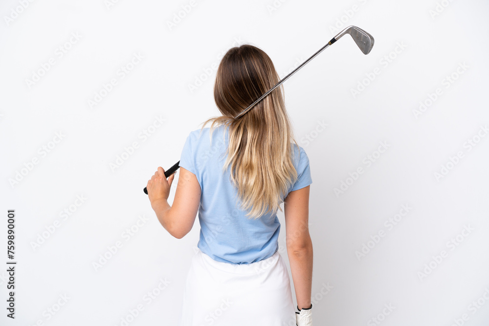 Young Romanian woman isolated on white background playing golf and in back position Young Romanian woman isolated on white background playing golf and in back position