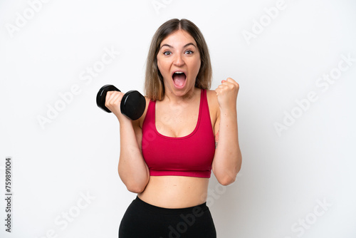 Young sport Rumanian woman making weightlifting isolated on white background celebrating a victory in winner position