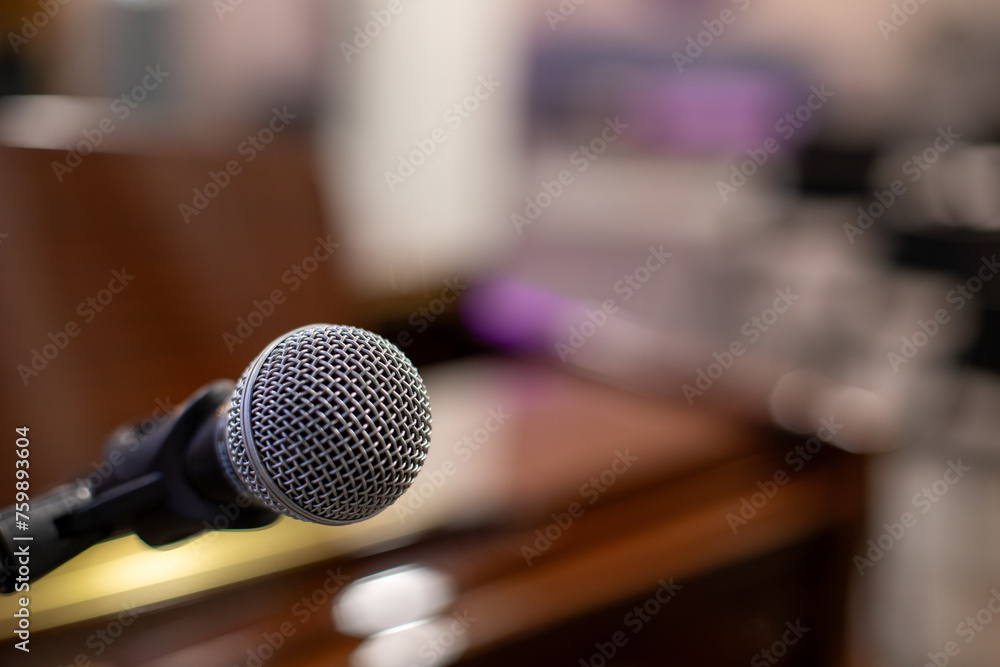 grey microphone in front of a piano grey microphone in front of a piano