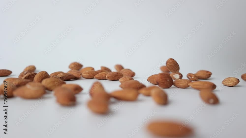 Nut almond on white background, slow motion Nut almond on white background, slow motion