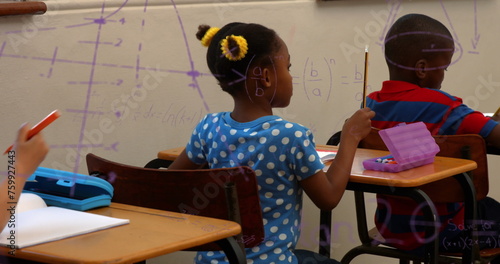 Image of math formulas over african american children learning at school