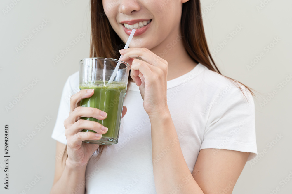 young woman drinking detox drink made by vegetable and fruit mixed. young woman drinking detox drink made by vegetable and fruit mixed.