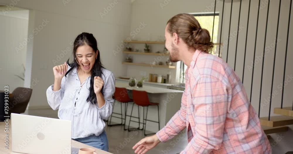 A biracial couple enjoys a playful moment at home A biracial couple enjoys a playful moment at home