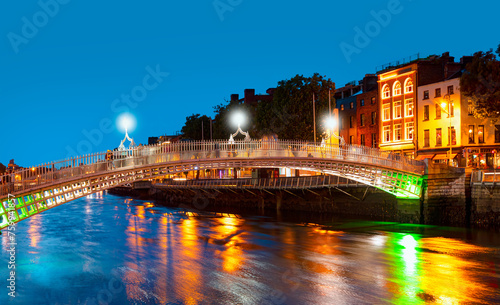 Ha'Penny Bridge at twilight blue hour - Dublin, Ireland. photo