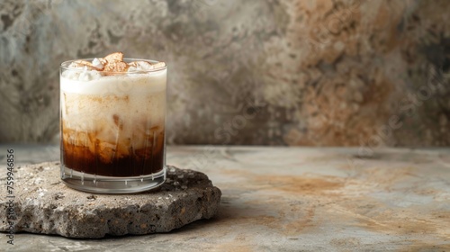 White Russian cocktail on podium on concrete background. Glass of alcoholic drink