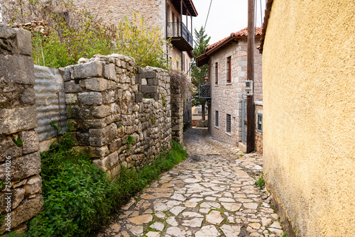 Street view of Dimitsana village in Arcadia, Peloponnese, Greece. Narrow cobblestone alleys. photo