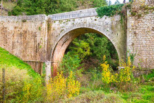 The stone bridge at the entrance of Dimitsana village in Peloponnese, Arcadia, Greece photo