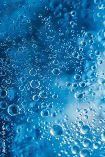 Microscopic water bubbles create a fascinating pattern on a blue surface.