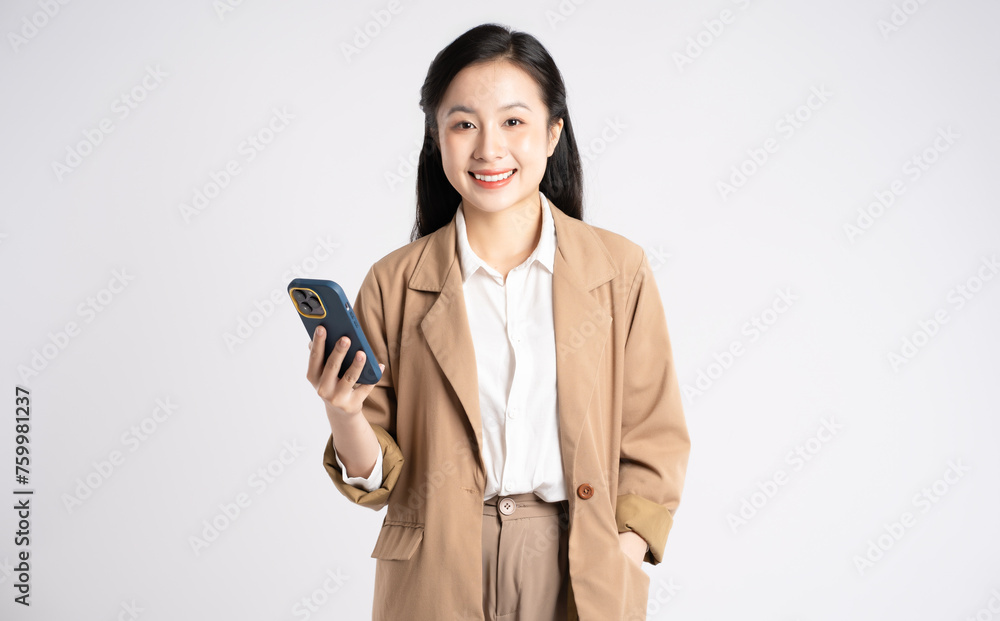 Portrait of young Asian businesswoman using phone on white background Portrait of young Asian businesswoman using phone on white background