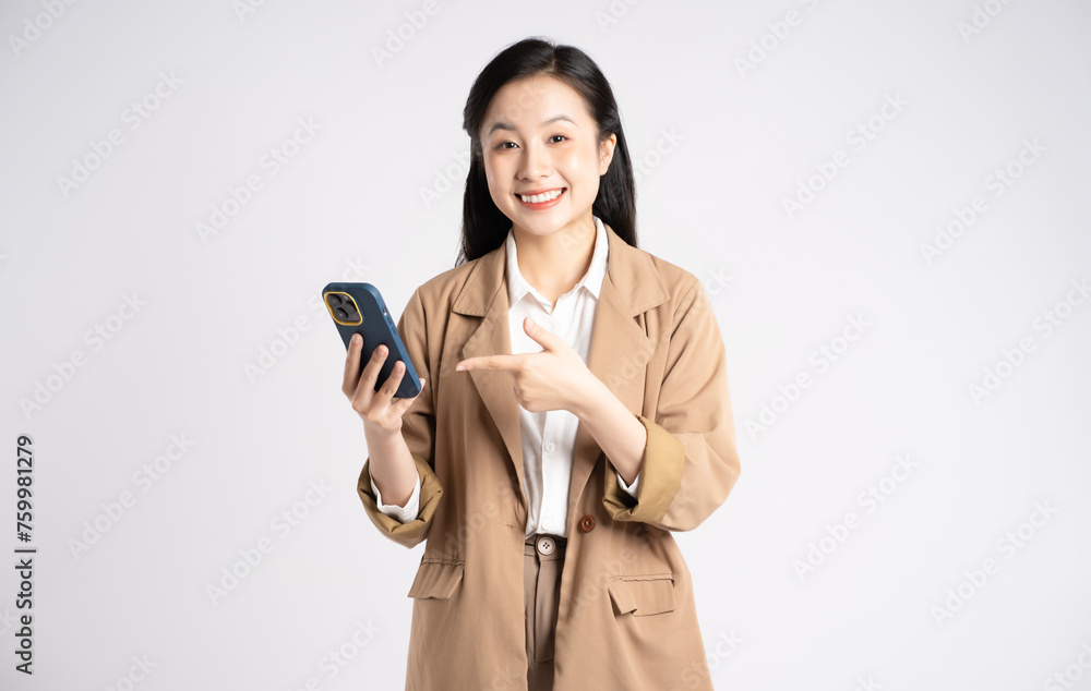 Portrait of young Asian businesswoman using phone on white background Portrait of young Asian businesswoman using phone on white background