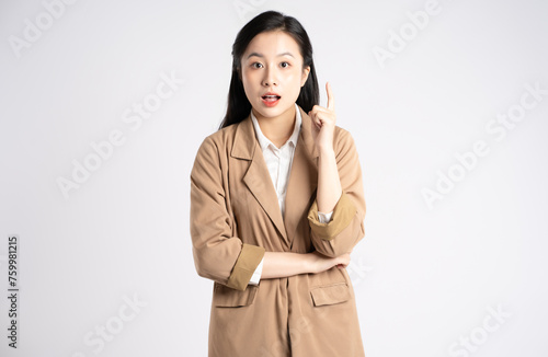 Portrait of young Asian businesswoman posing on white background