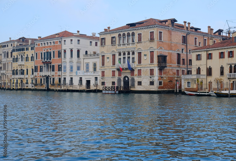 Traditional view of historic houses in Venice, Italy from the Grand Canal. Green Canal Water. Sinking Venice.