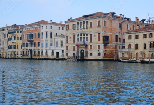 Traditional view of historic houses in Venice, Italy from the Grand Canal. Green Canal Water. Sinking Venice. © Yuliya