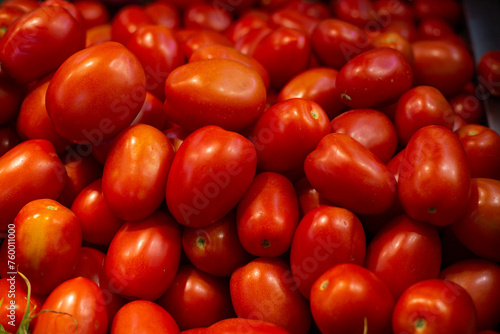 red tomatoes in market © elias