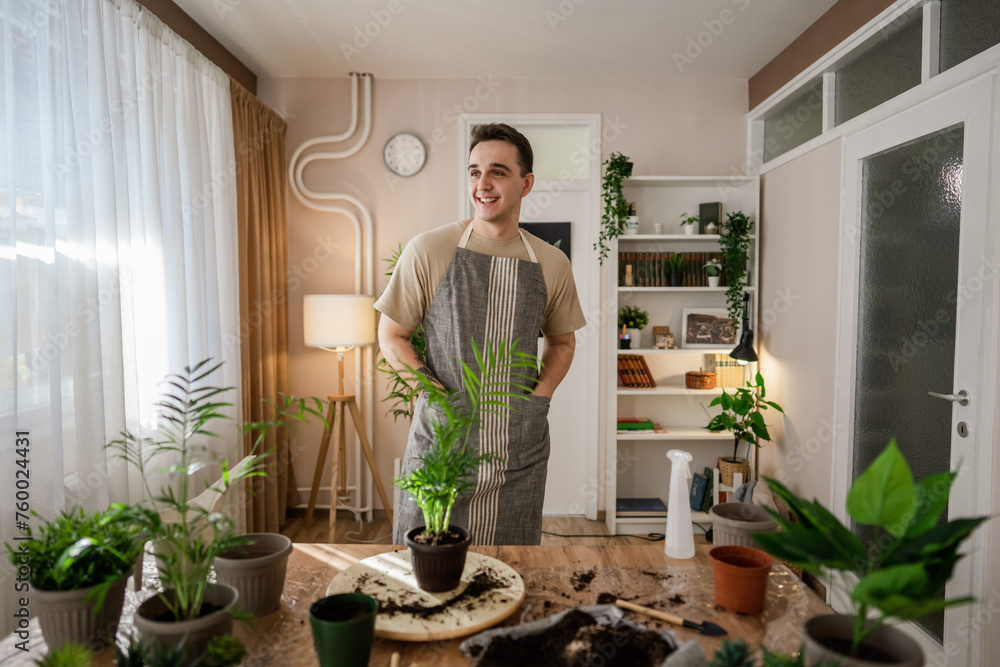 man gardener florist take care grow cultivate plants at home