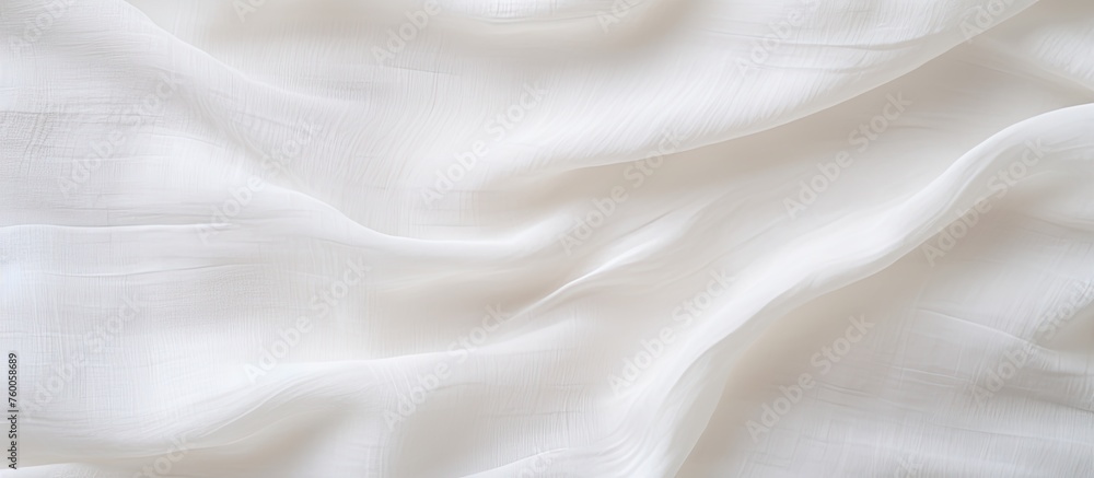 A detailed shot of a white cloth displaying wave patterns, resembling fur. The material is transparent, creating a peachcolored hue, perfect for event flooring or paper design A detailed shot of a white cloth displaying wave patterns, resembling fur. The material is transparent, creating a peachcolored hue, perfect for event flooring or paper design