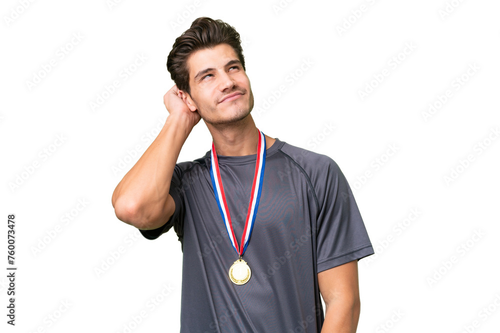 Young caucasian man with medals over isolated background thinking an idea Young caucasian man with medals over isolated background thinking an idea