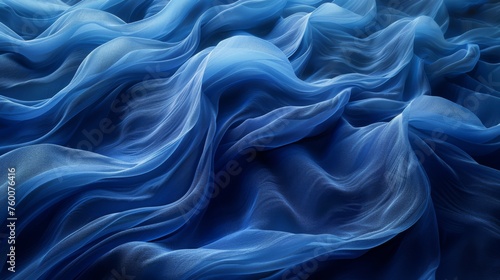  a close up of a blue fabric with wavy lines in the center of the fabric is very smooth and blurry.
