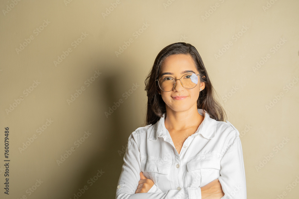 young latin business woman with glasses looking forward smiling conveying security and closeness