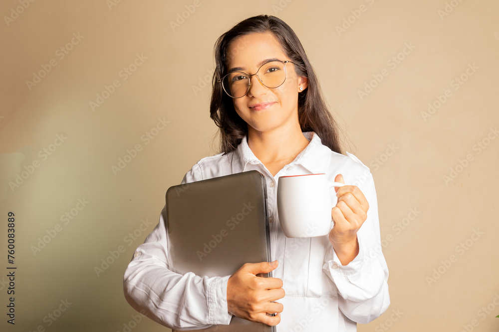 young student woman with glasses, holding a notebook, happy and confident dressed stylishly in a white shirt, on a soft orange background young student woman with glasses, holding a notebook, happy and confident dressed stylishly in a white shirt, on a soft orange background