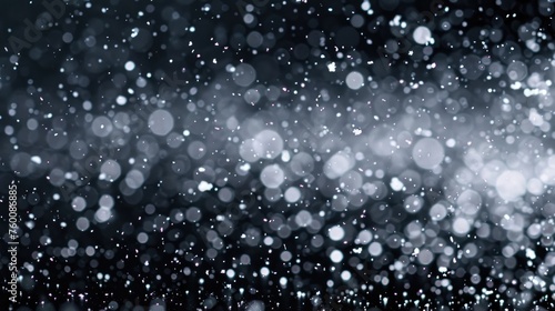 Dust Particles in White Snowfall: Bokeh Effect of Flying Snowflakes on Abstract Black Background for Holiday Overlay