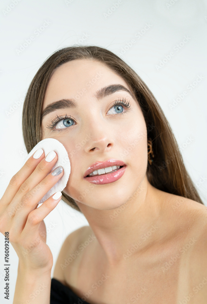 Beautiful blonde woman removing makeup from her face Beautiful blonde woman removing makeup from her face