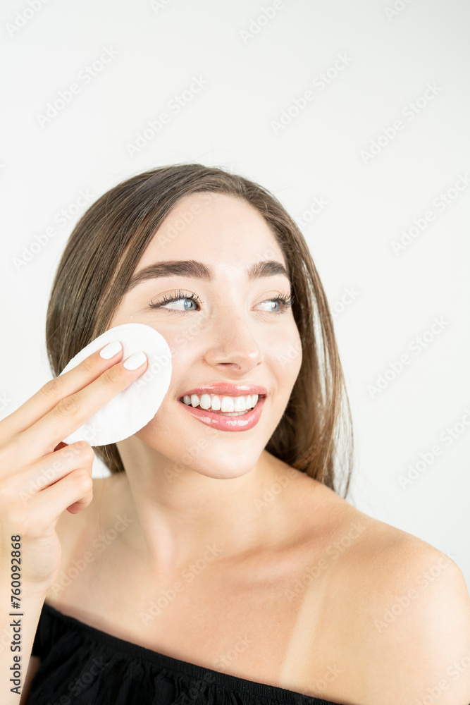 Beautiful blonde woman removing makeup from her face Beautiful blonde woman removing makeup from her face