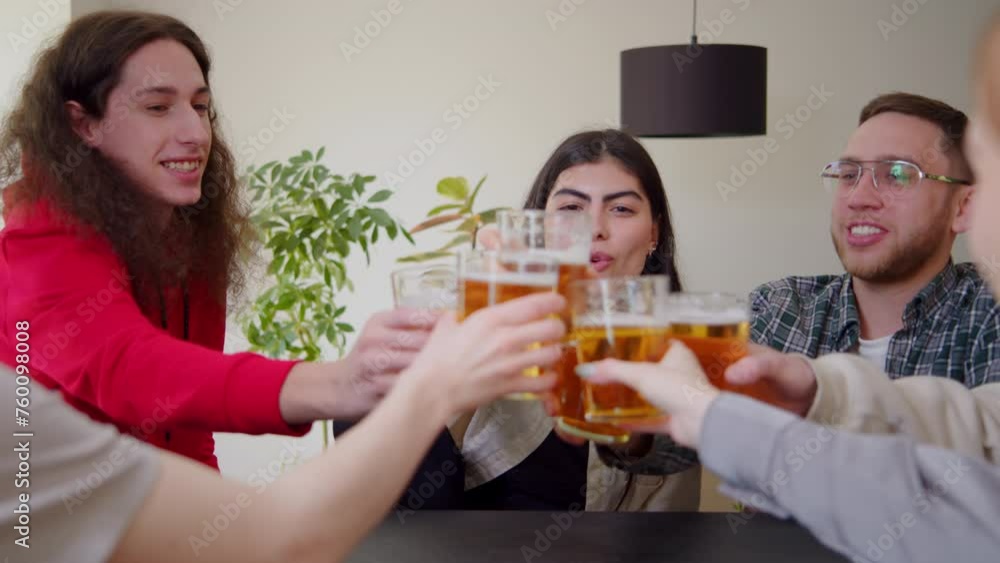 Celebration beer cheers concept, hands holding up bottles beer people group in outdoor party vacation. Slow motion close up happy young friends having fun together drinking beer clinking glasses pub. Celebration beer cheers concept, hands holding up bottles beer people group in outdoor party vacation. Slow motion close up happy young friends having fun together drinking beer clinking glasses pub.