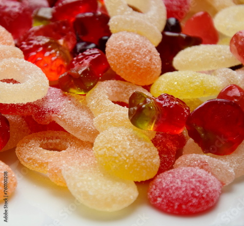 Lots of colorful candies made of jelly and various fruits, background and texture