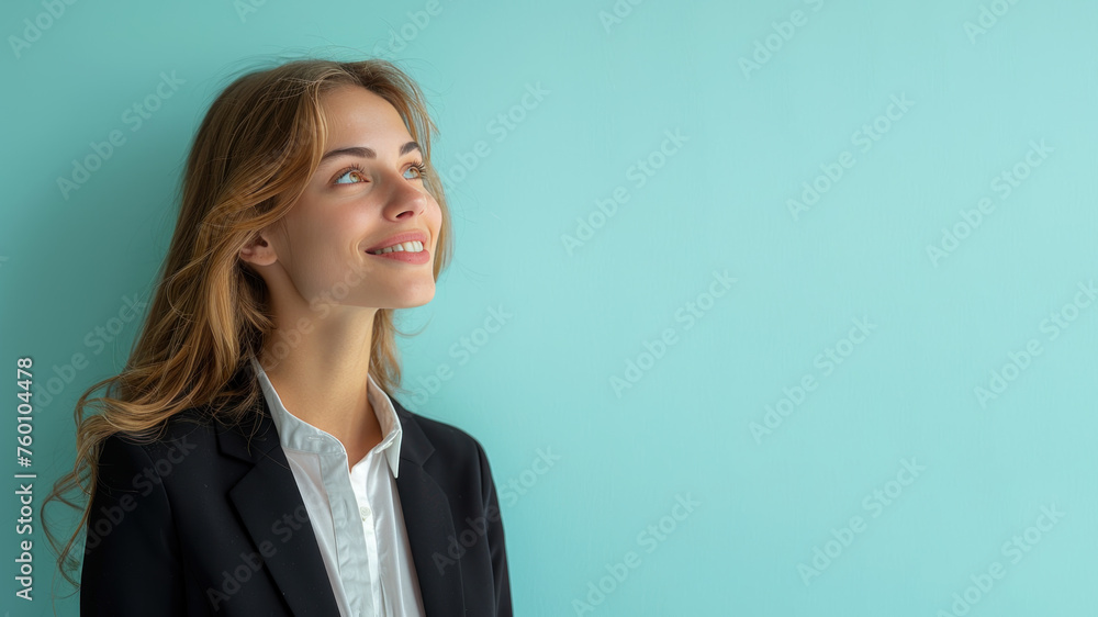 Caucasian businesswoman in black formal suit smiling isolated on pastel Caucasian businesswoman in black formal suit smiling isolated on pastel